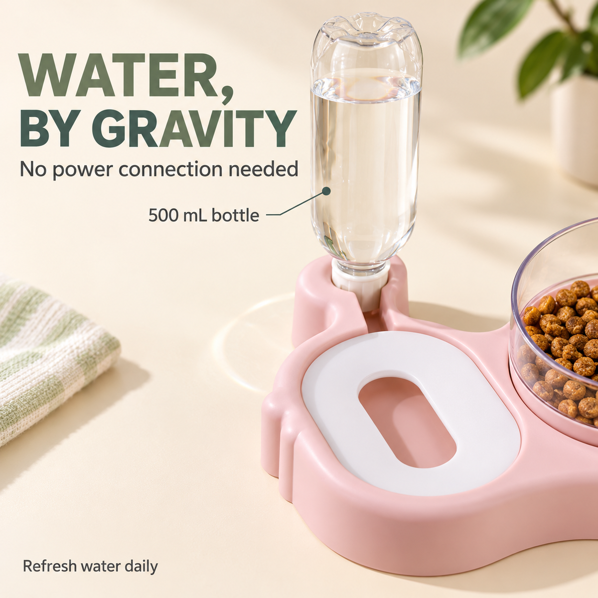 Gravity-fed 500 mL water bottle seated behind the covered water tray